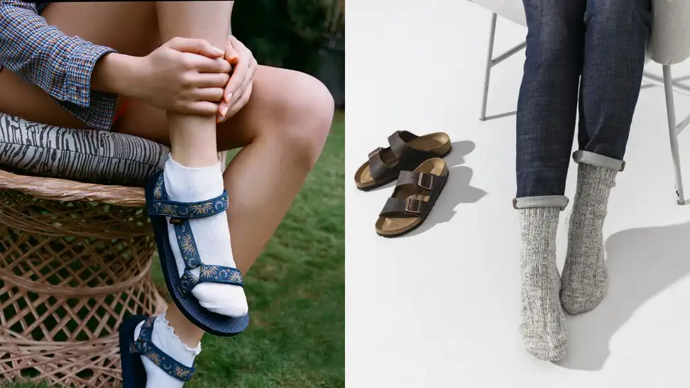 Woman wearing pair of Teva sandals with white ankle-length socks sitting on a rattan chair, woman wearing blue jeans and grey Birkenstock socks, sitting down on a grey chair next to a pair of Birkenstock Arizona sandals.