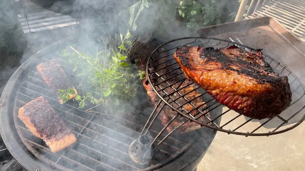 Meat smoking on a grill.
