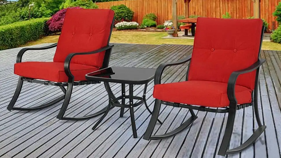 Two red patio chairs outdoors.