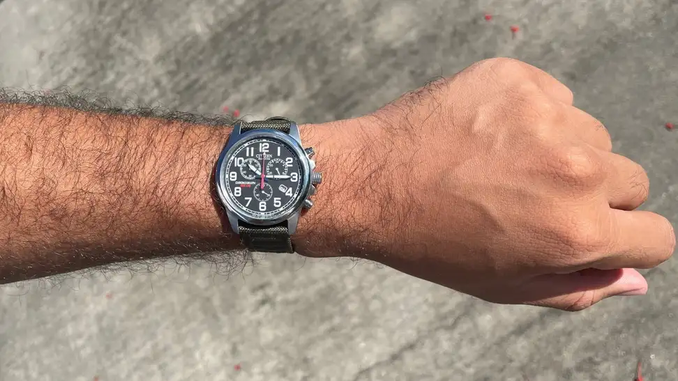 Man showing off Citizen AT0200-05E Eco-Drive Chronograph Canvas Watch on his wrist.