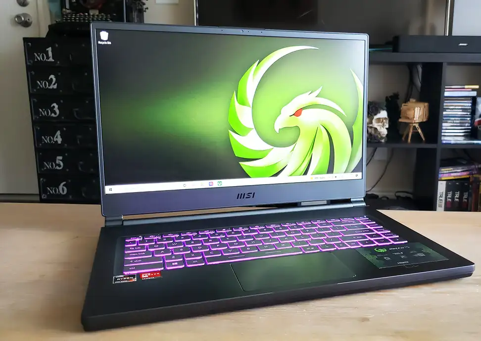 A laptop on top of a wooden coffee table