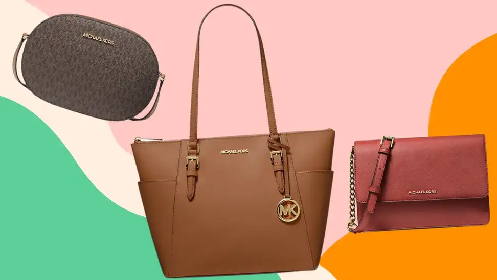 A small brown crossbody bag, a brown tote, and a red purse from Michael Kors.