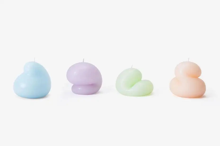 Four Goober candles lined up in a row