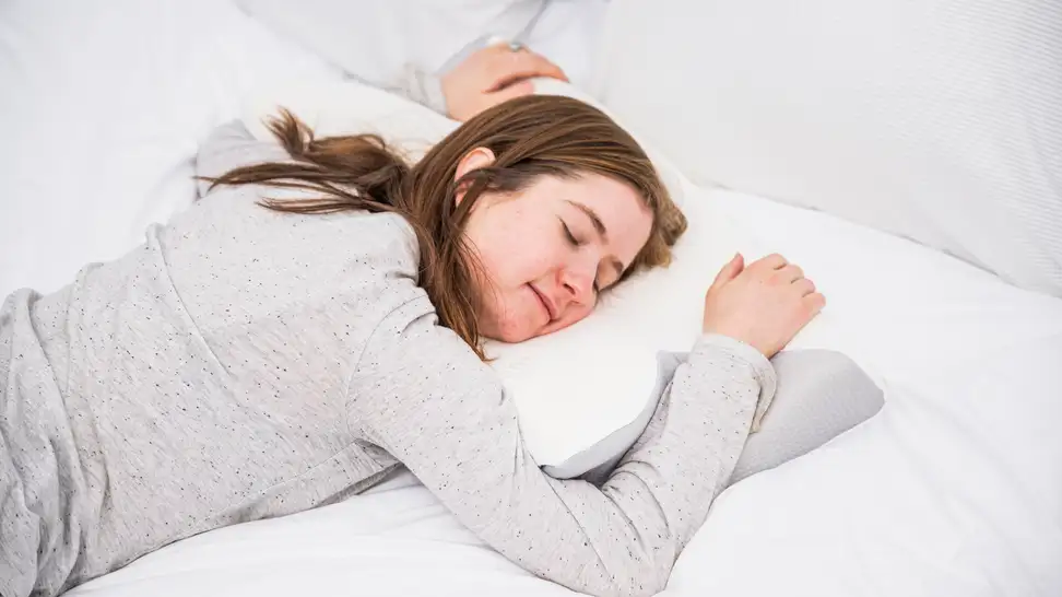Sleep writer Sara Tabin sleeps on her stomach using the dream deep pillow.
