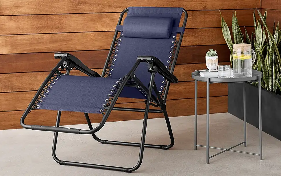 A zero gravity recliner sitting on a homeowner's front porch.