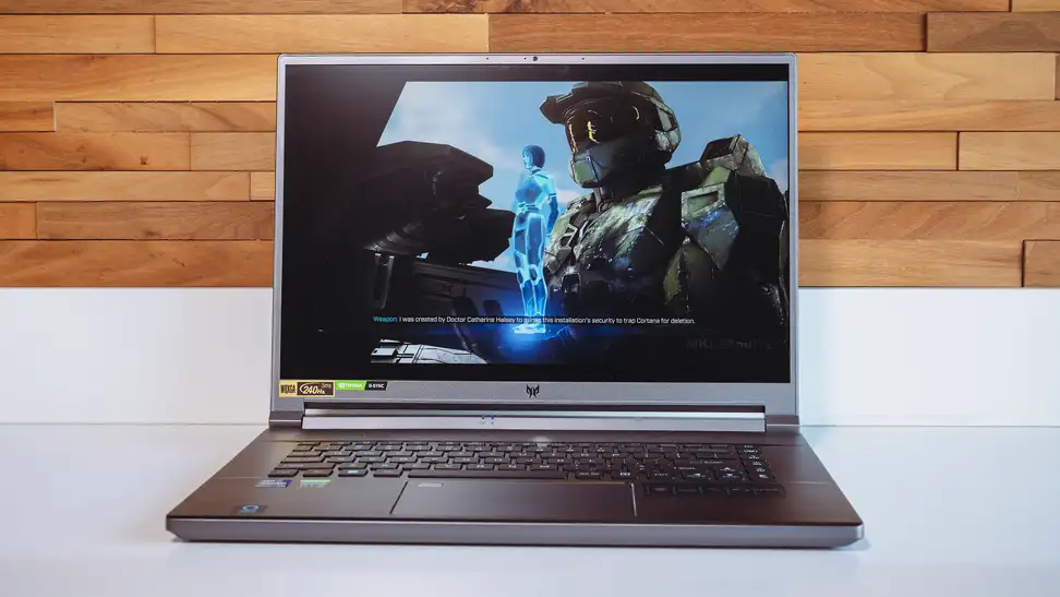 Person plays a game on the laptop with a mouse plugged in.