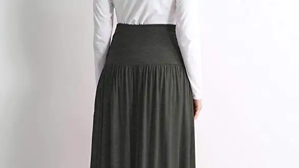 A female model wearing a Simlu maxi skirt.