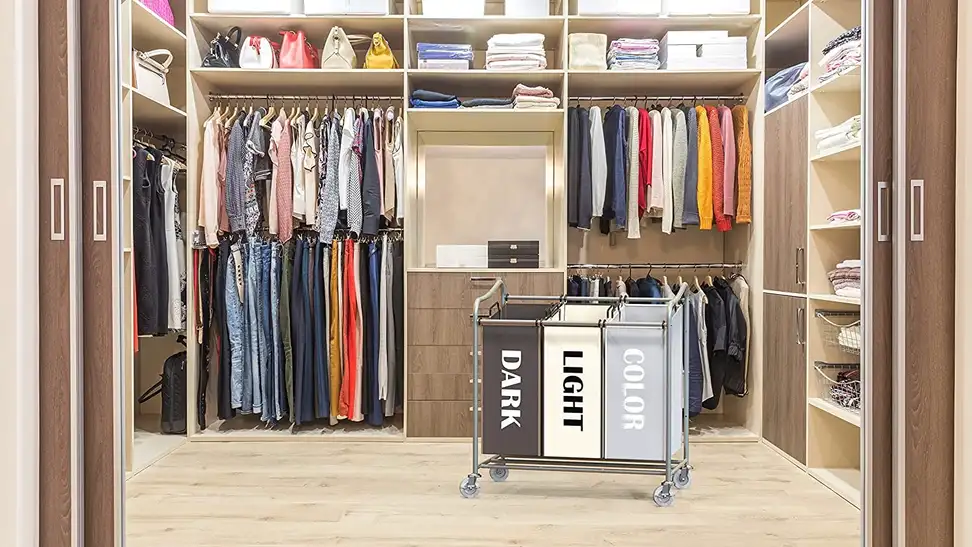 A laundry basket on wheels in a homeowner's closet.