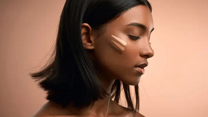 person showing a side profile with foundation on their face
