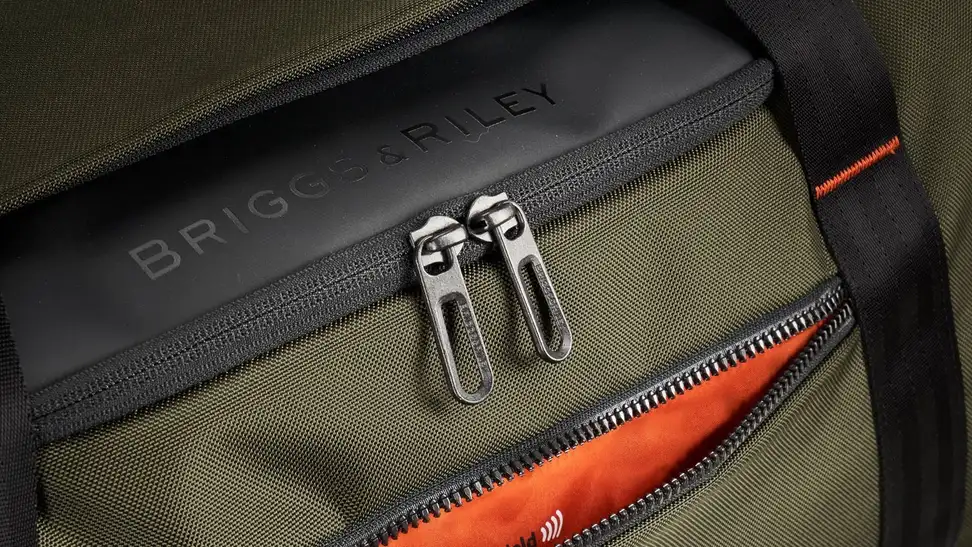 Close-up of the hunter green Briggs & Riley ZDX large duffel bag