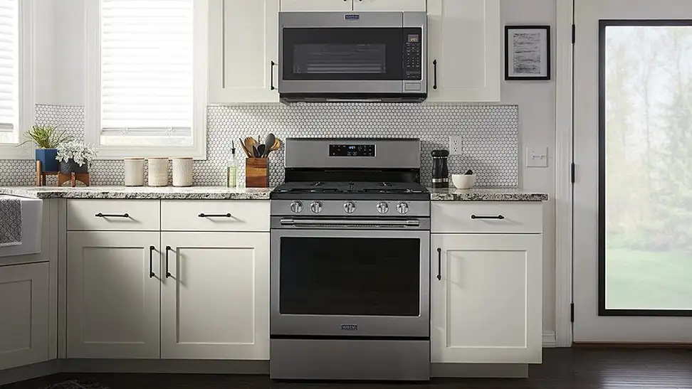 Maytag MGR7700LZ Gas range in modern kitchen setting.