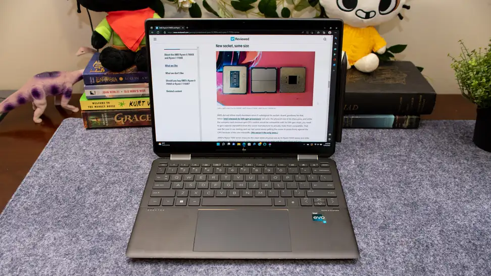 The HP Spectre x360 14 opened on top of a desk.