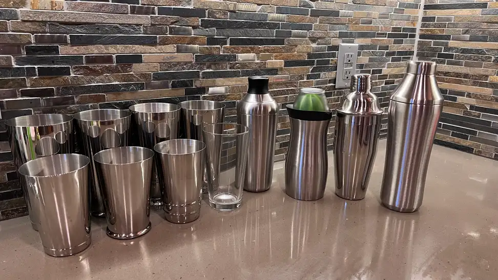 A large selection of cocktail shakers waiting to be tested