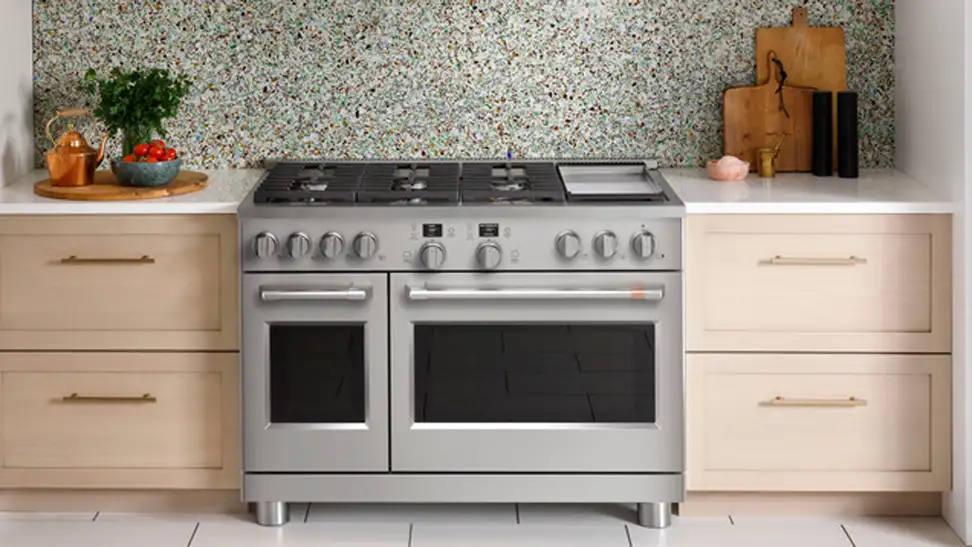 The GE Cafe C2Y486P3TD1 Gas Range hooked up in place inside a kitchen.