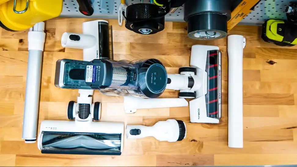 Everything that comes in the box of the Tineco Pure One S11 on a workbench.