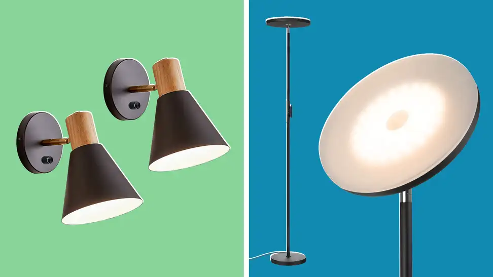 Two black and gold wall lamps next to a black floor lamp with a circle light.