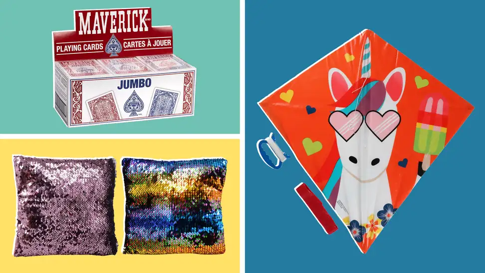 A box of playing cards on a teal background, two sequin pillows on a yellow background, and a unicorn kite on a blue background.