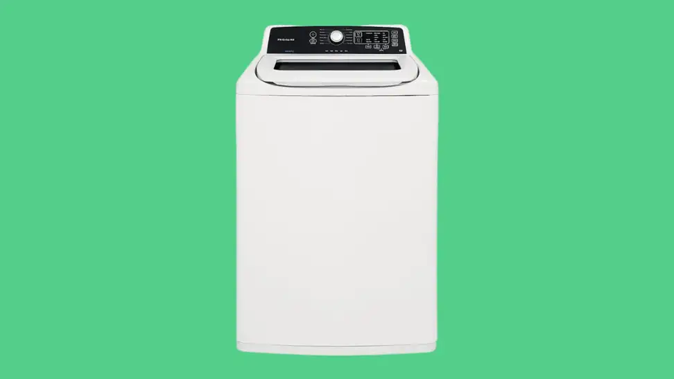The Frigidaire FFTW4120SW top-load washing machine sits on a green background