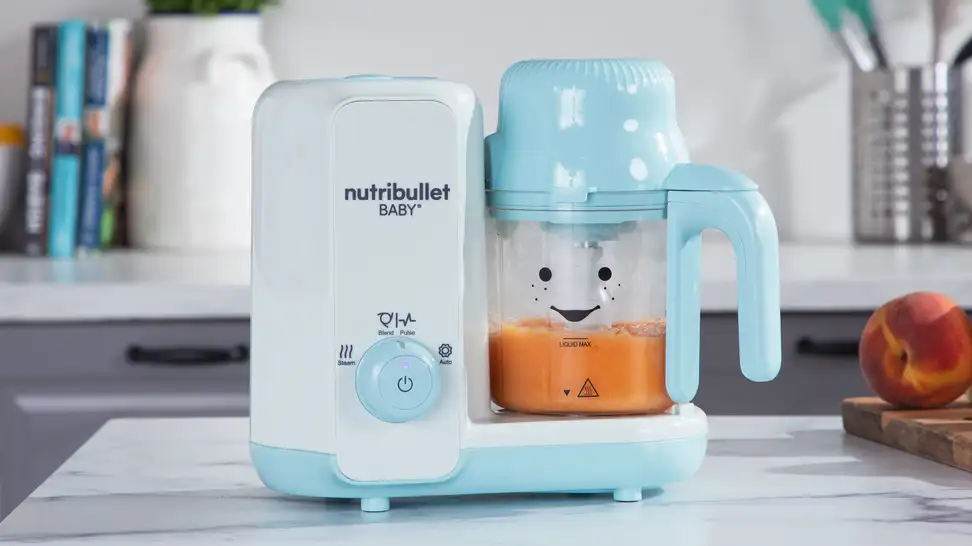 The Nutribullet Baby Steam + Blend on a counter.