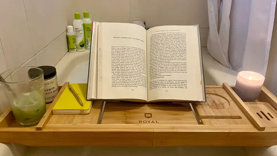 A bath tray being used in a bathtub.