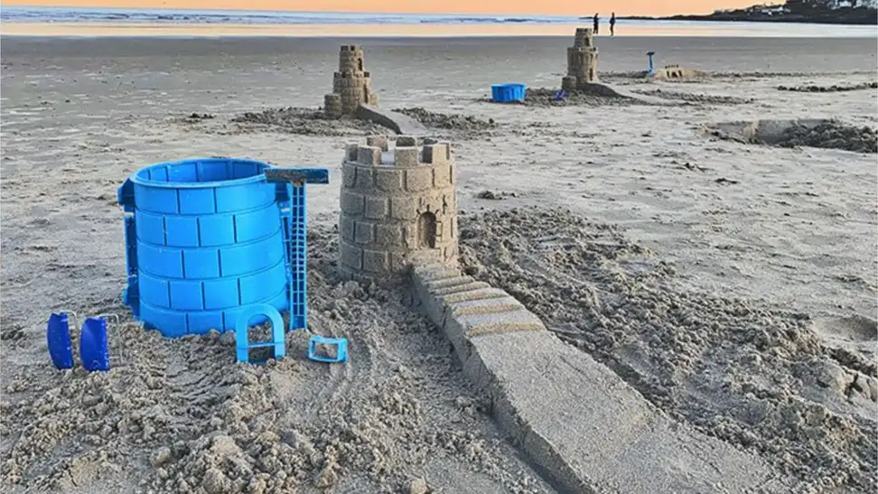 Sandcastles on a beach created by Create-a-Castle