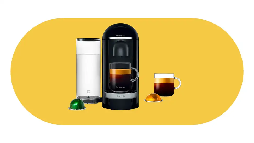 The Nespresso VertuoPlus coffeemaker on a yellow background.