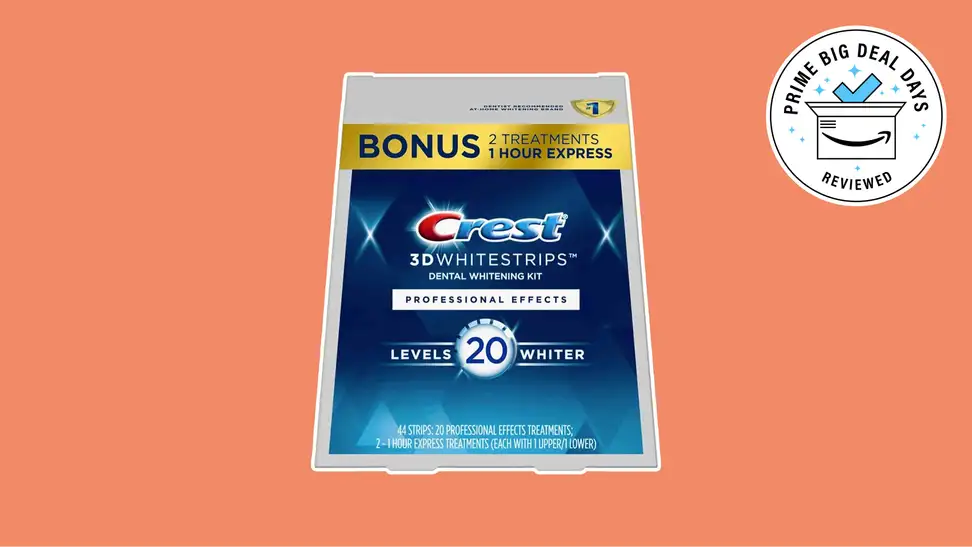 Crest 3D Whitestrips package on an orange background