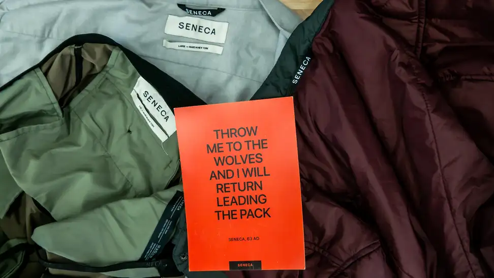 Seneca pants, shirt, and jackets arranged in a circle
