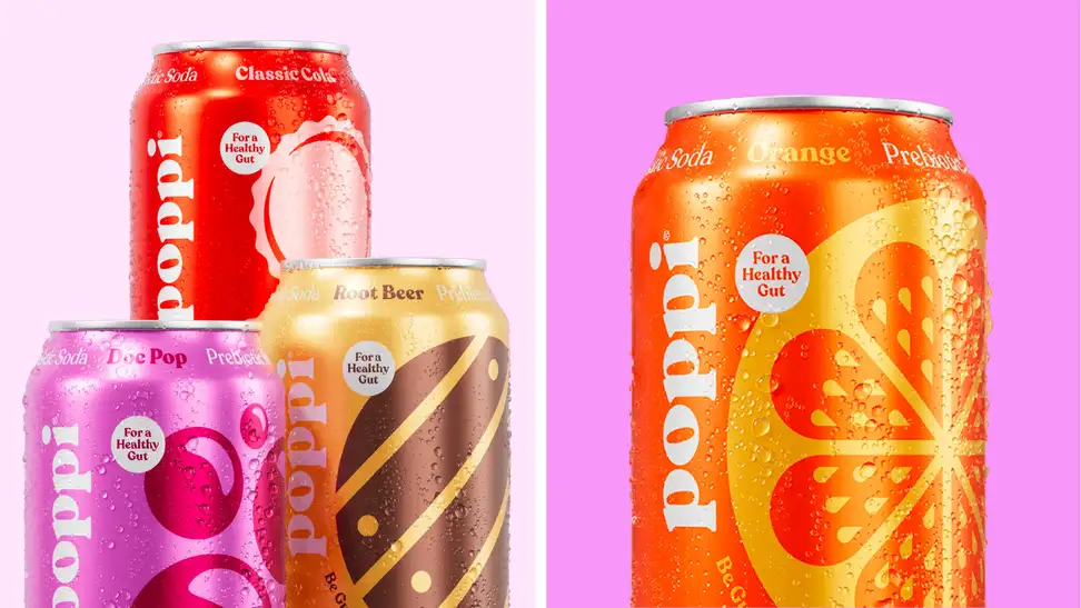 An image of several cans of Poppi soda, including a can of Doc Pop, Clasisic Cola, Root Beer, and Orange soda.