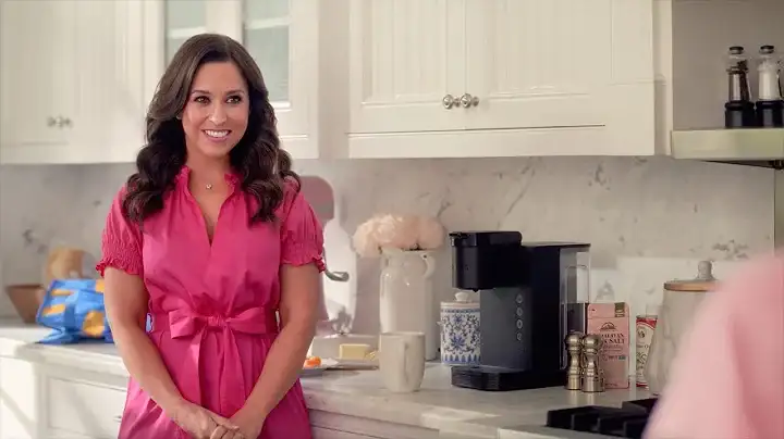 Lacey Chabert as Mean Girls' Gretchen Wieners, wearing pink shirt