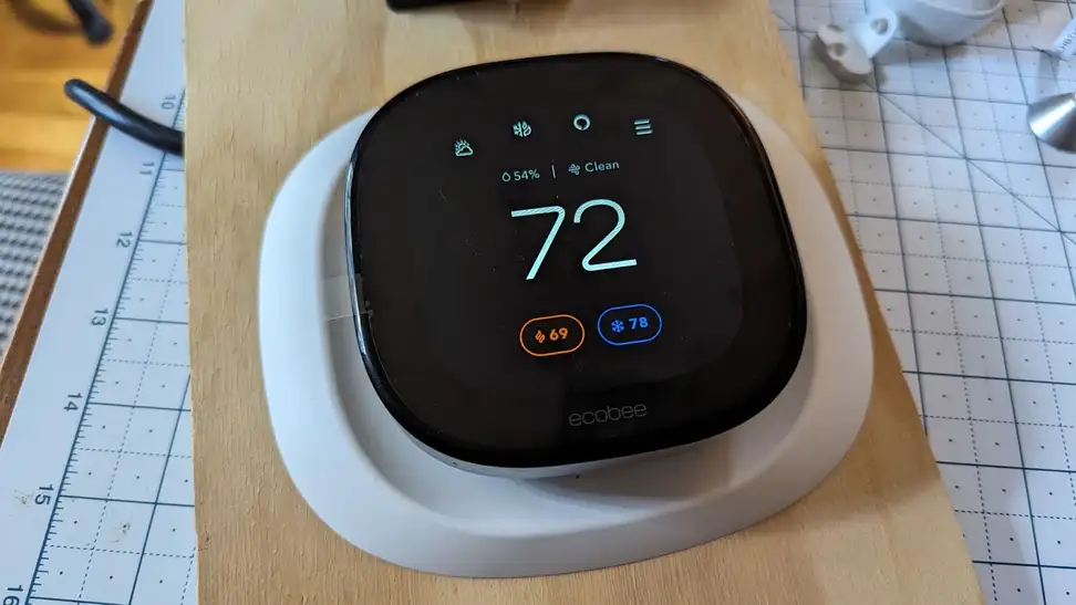 The Ecobee Smart Thermostat Premium is shown mounted on a board for testing.