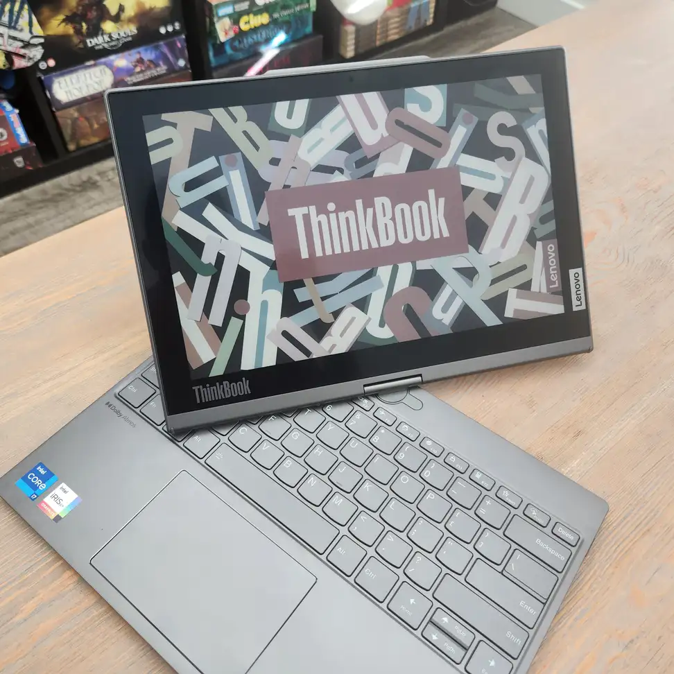 A silver laptop with its display twisted to the side.