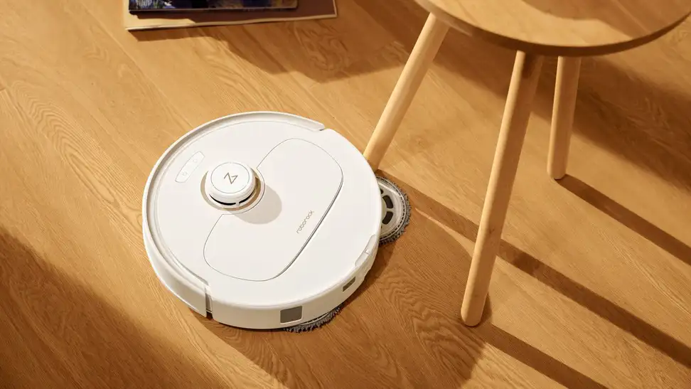 The Roborock S8 MaxV Ultra cleaning around a table