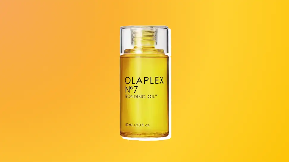 Olaplex hair oil against an orange and yellow background.