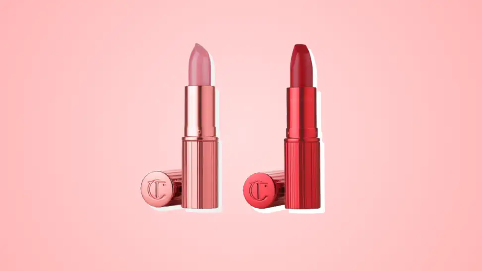 Two Charlotte Tilbury Hollywood Icon Beauty lipsticks in pink and red against a pink background.