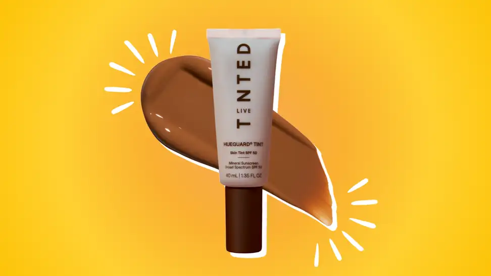 Live Tinted Hueguard Sunscreen against an orange and yellow background.
