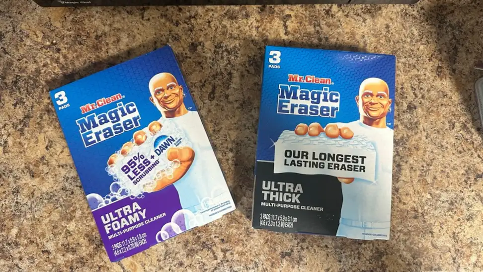The two Magic Erasers side by side atop a countertop.
