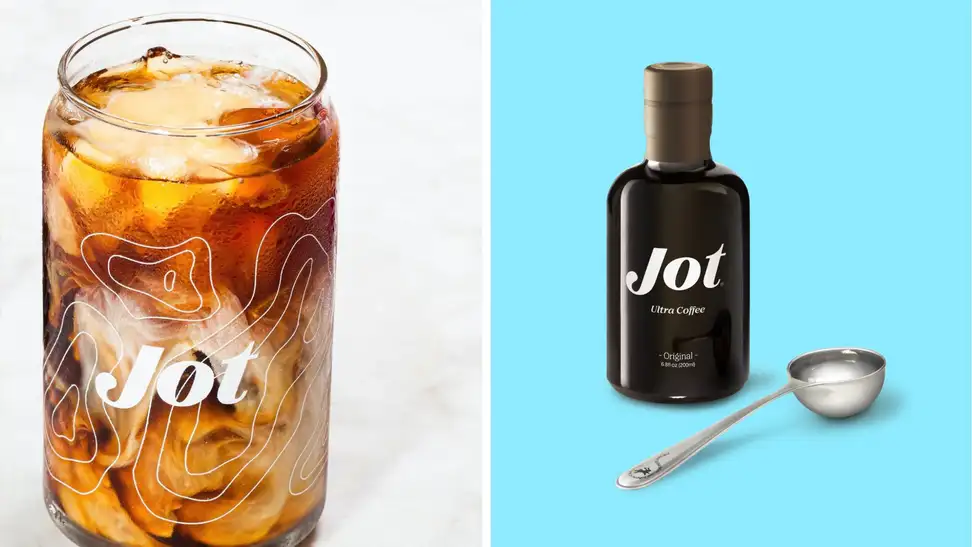 A Jot coffee glass next to a container of Jot coffee concentrate in front of a colored background,