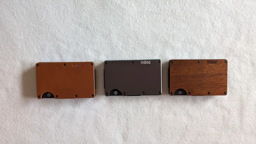 Three wallets against a white background.