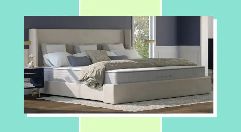 Large mattress in a bedroom with sheets and pillows