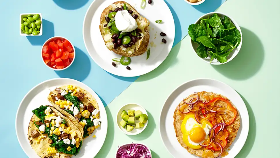 Healthy plates of food on blue and green background