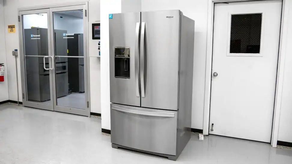 A wide shot of the Whirlpool WRF767SDHZ French-door refrigerator sitting outside our fridge testing labs.