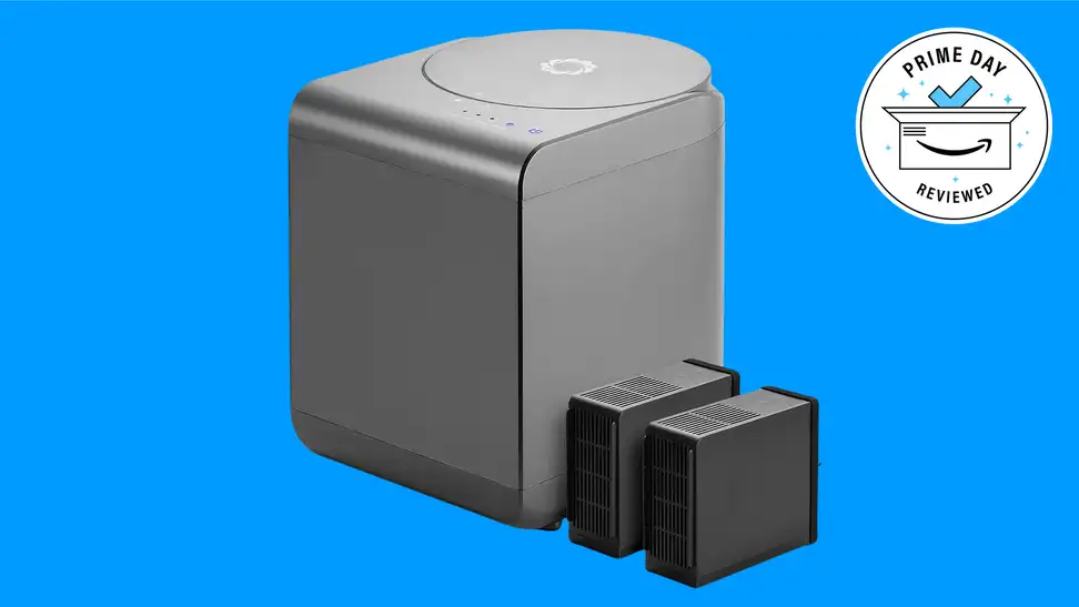 A grey Airthereal Revive Electric Kitchen Composter against a blue background.