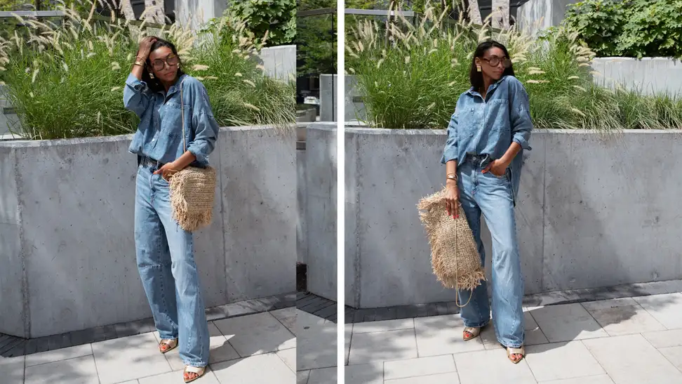 A woman wearing jeans and a denim shirt, gold shoes, sunglasses, and a raffia pillowcase that she turned into a purse.