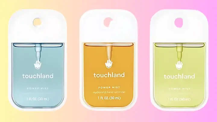 Three Touchland hand sanitizers on a colored background