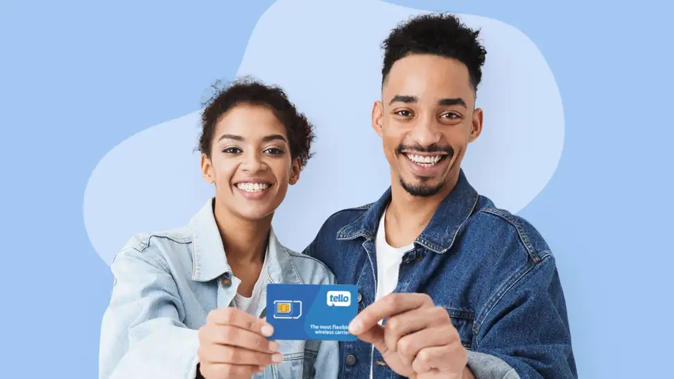 A man and a woman hold a Tello Mobile phone card