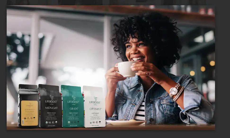 Woman drinking Lifeboost Coffee