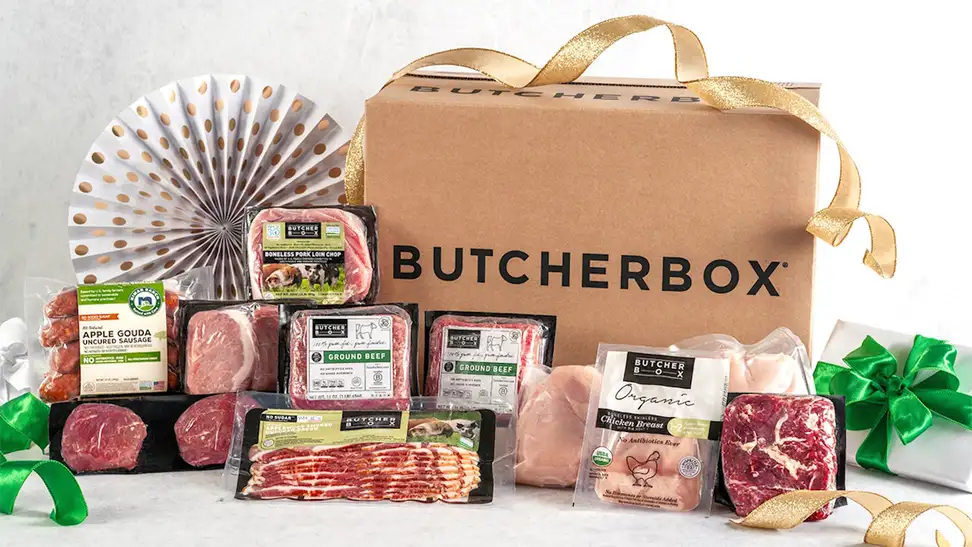 ButcherBox meat delivery gift box featuring assorted high-quality cuts of beef, pork, chicken, and sausage packaged for home delivery.