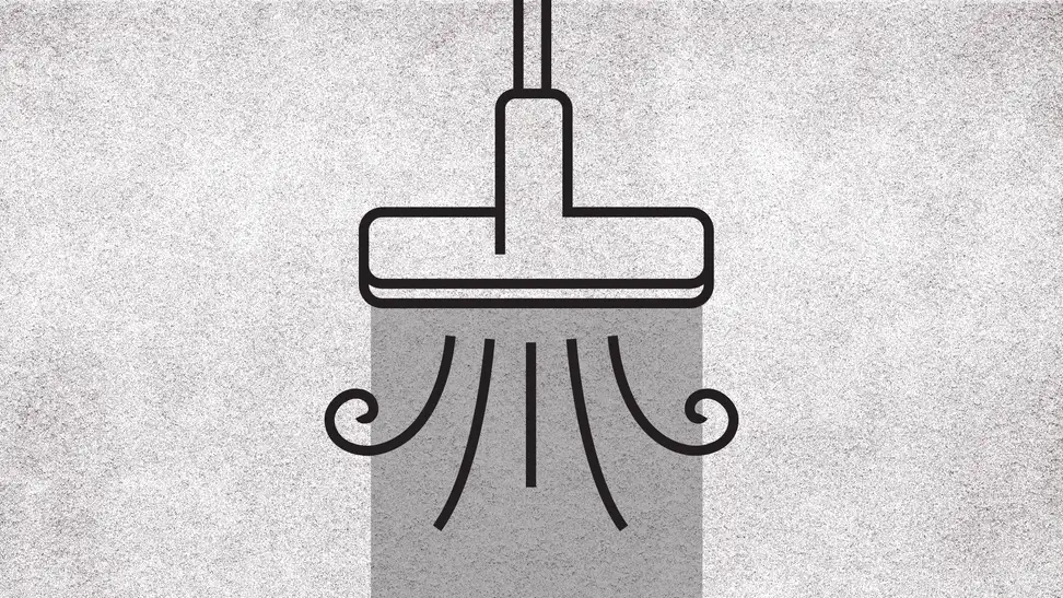 A graphic of a vacuum sucking up a rug