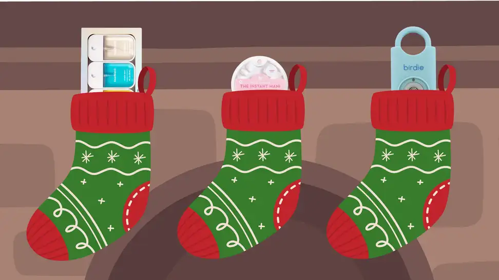 Three gifts stuck in three stockings hanging on a mantel